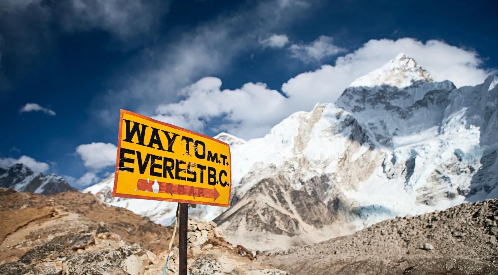 A signpost reading Way to Mt Everest B.C. with the summit behind