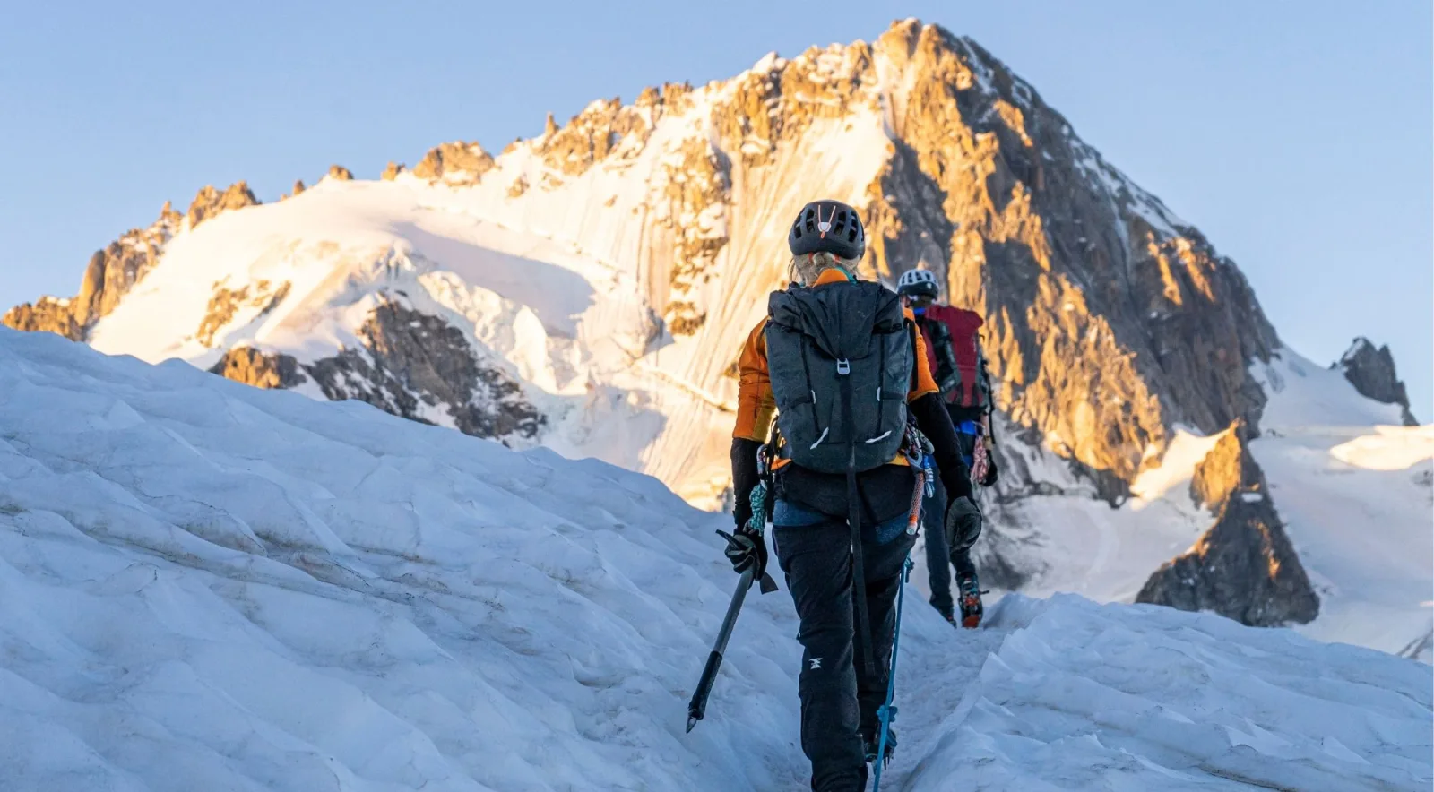 Climbers roped together crossing a snow ridge in the Khumbu